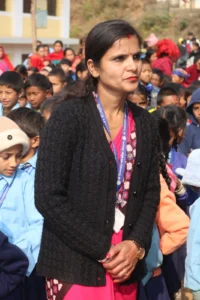 A teacher speaks to the assembly