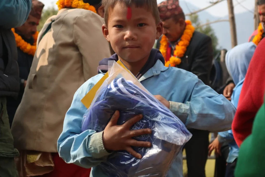 A boy with his new uniform pack