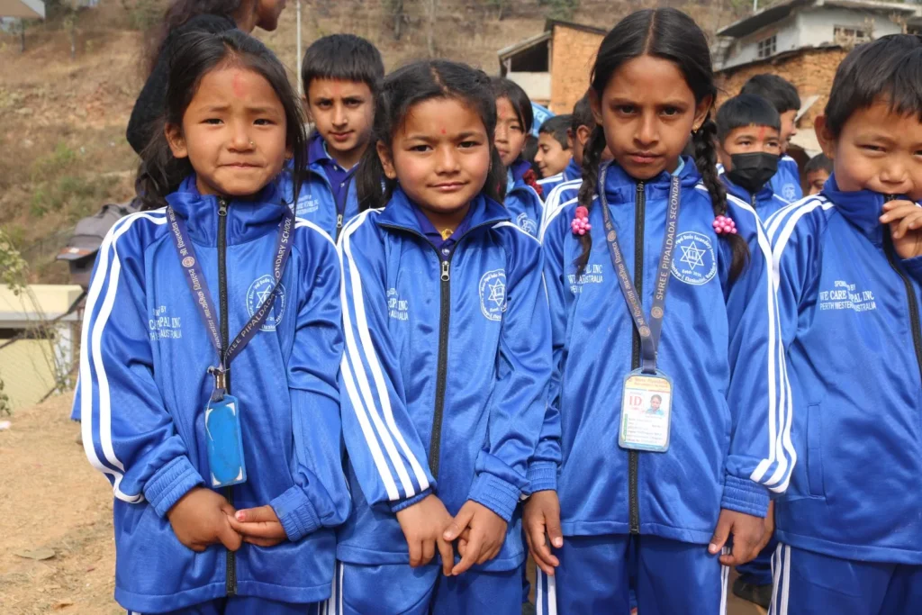 Students in their new blue tracksuits
