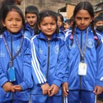 Students in their new blue tracksuits