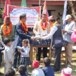 Handing out uniforms in the courtyard