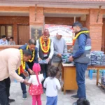 A young student collects her uniform